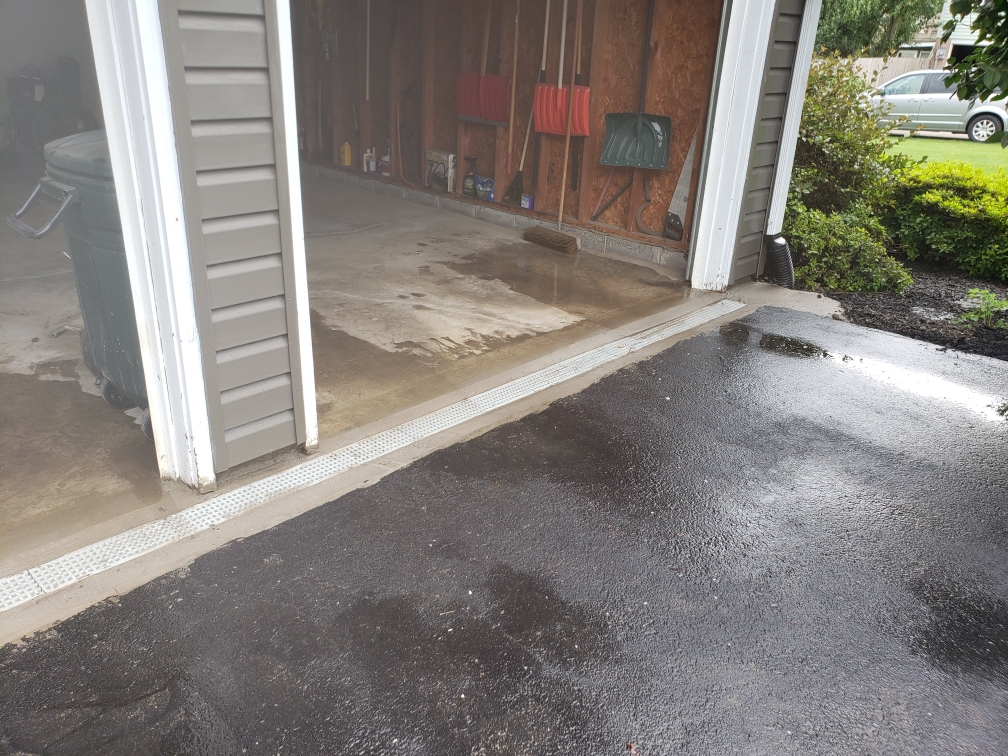 water in front of garage doors